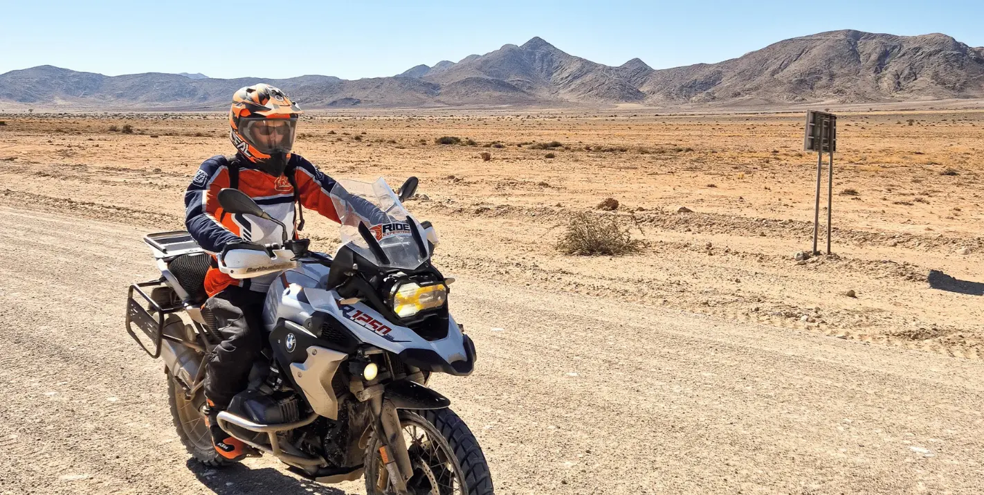 BMW adventure motorcycle rental on a gravel road in Cape Town from Adv Bike Co.